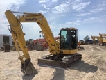 Used Komatsu excavator in yard